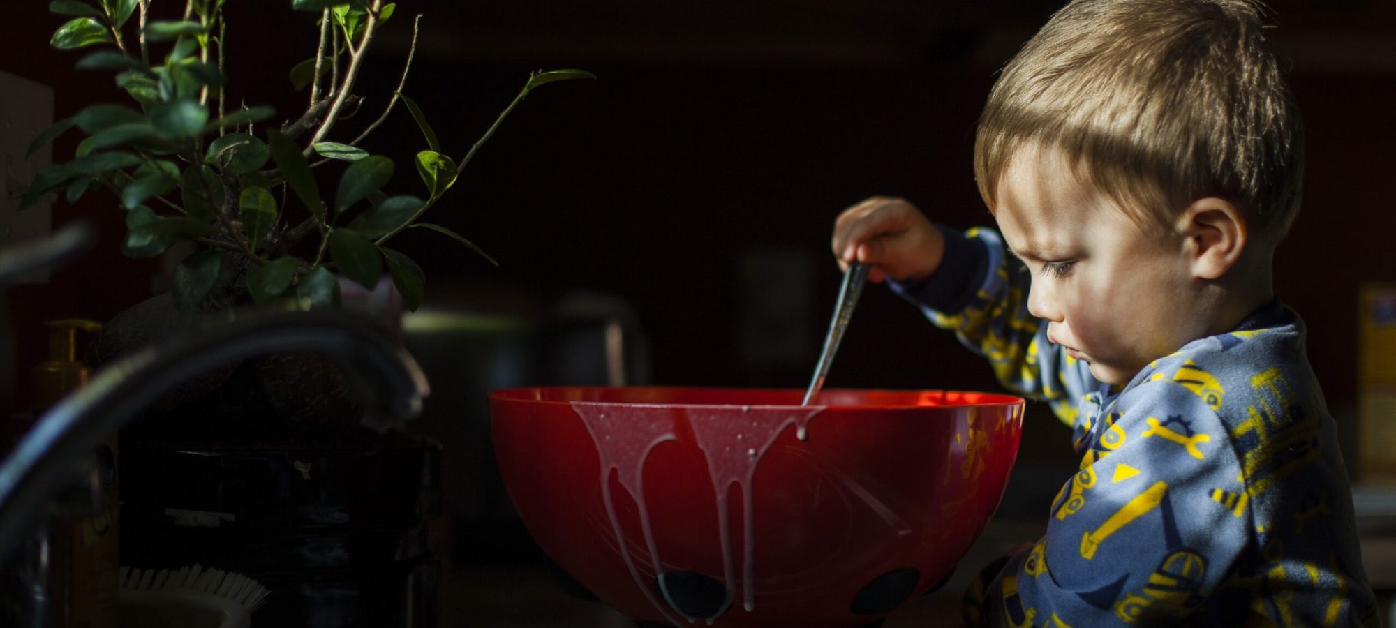 boy-playing-with-food-in-kitchen-2022-03-09-02-21-50-utc-scaled.jpg